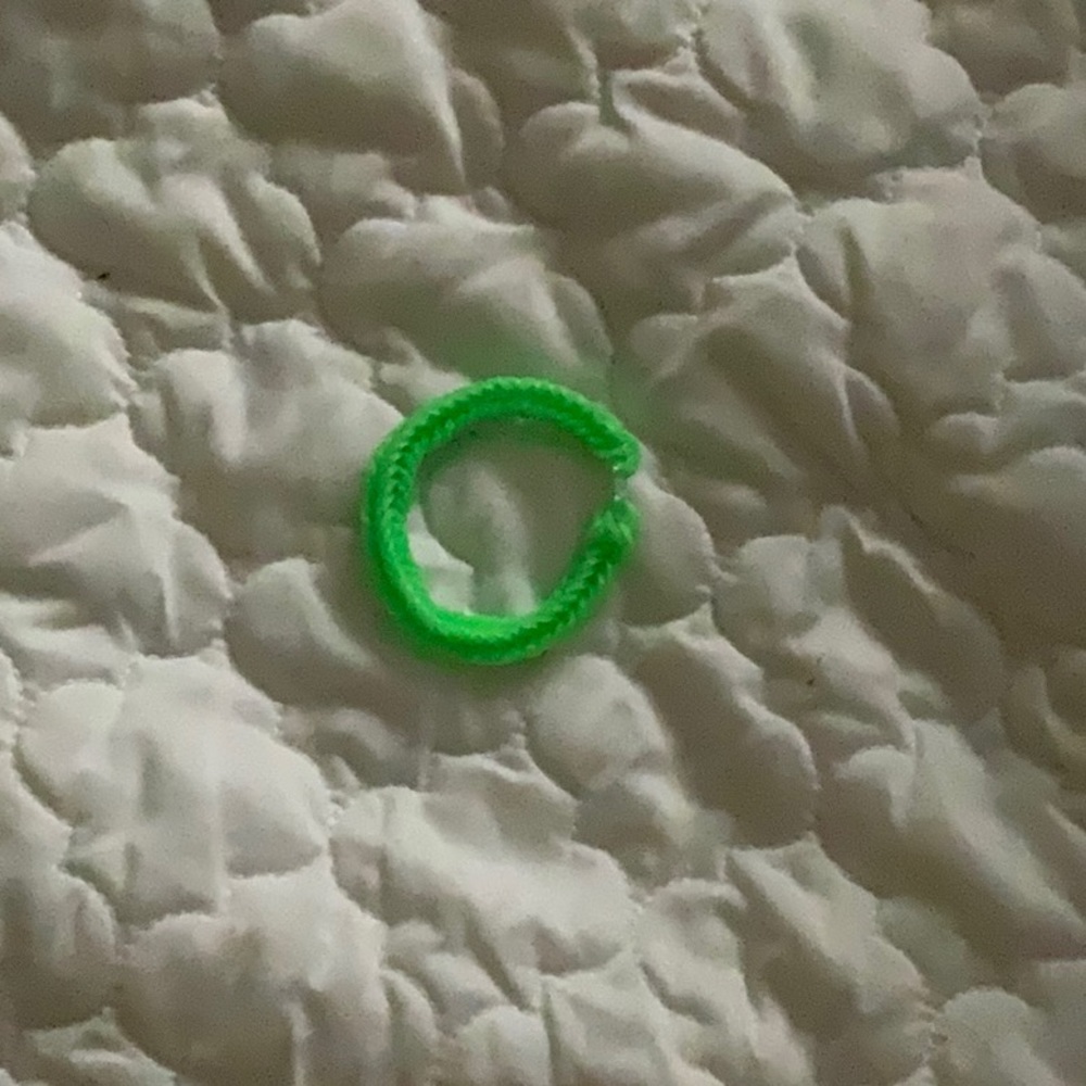 this is a handmade ,neon green,rubber band bracelet and is very stretchy.